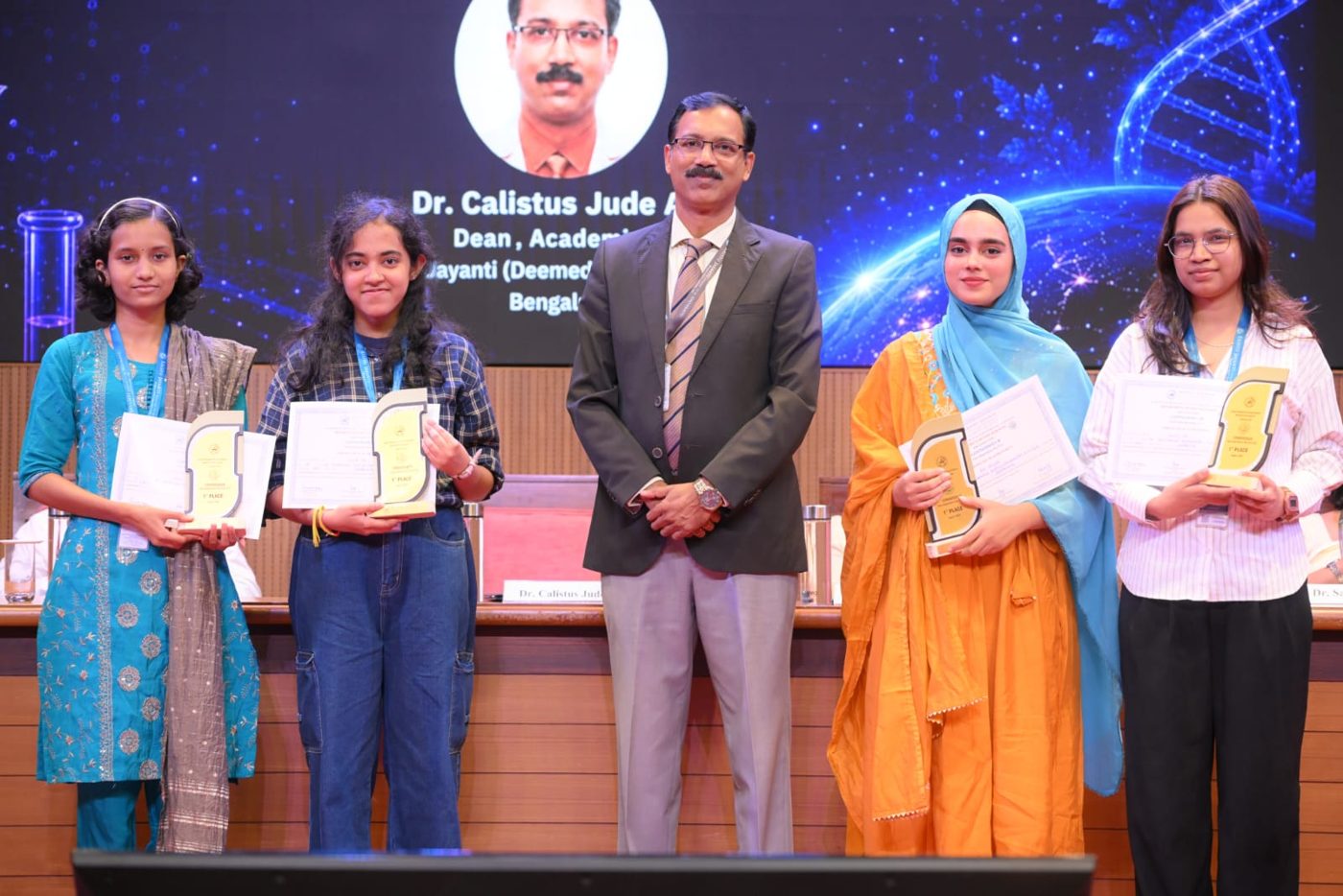 Arfa receiving a certificate on stage